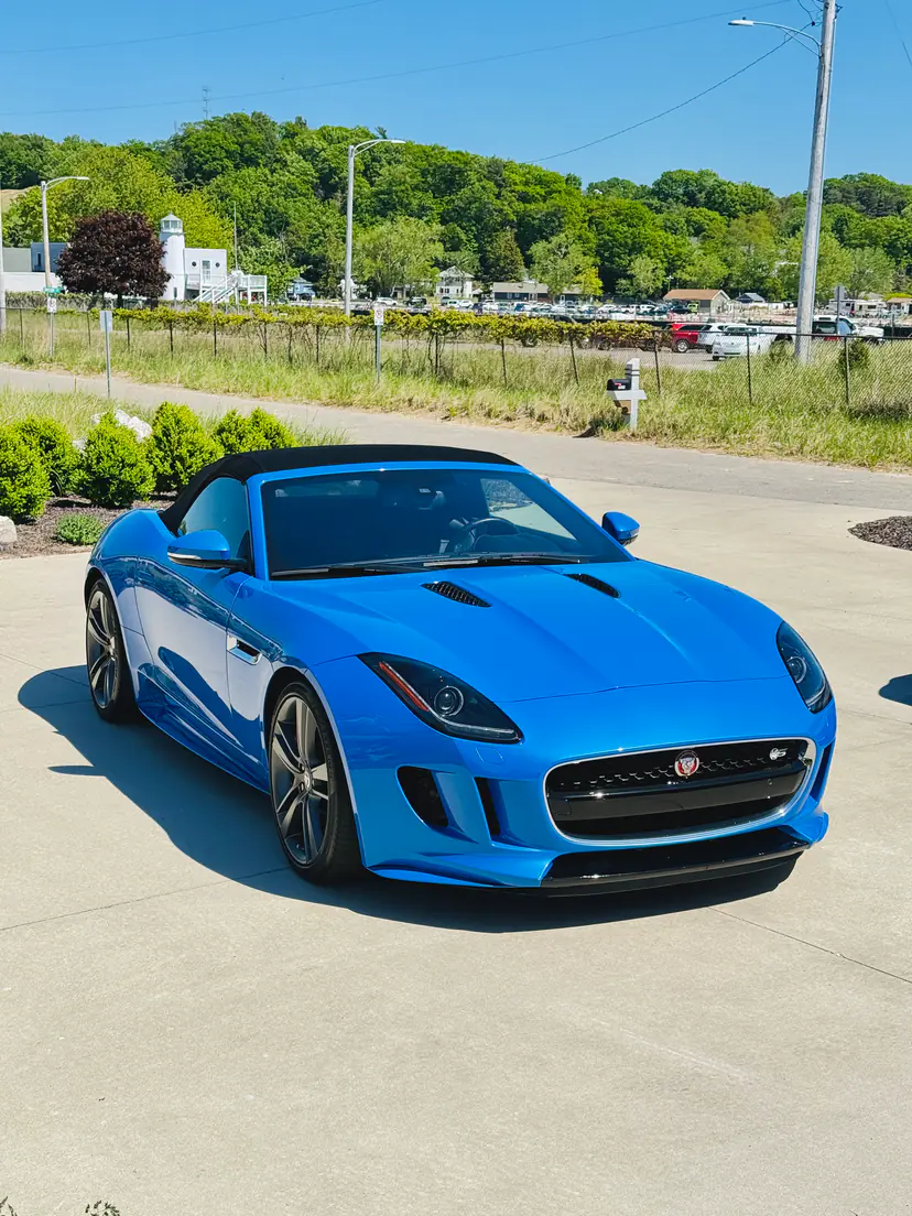 Bright blue Jaguar F-Type convertible with a deep, glossy finish after an exterior detail