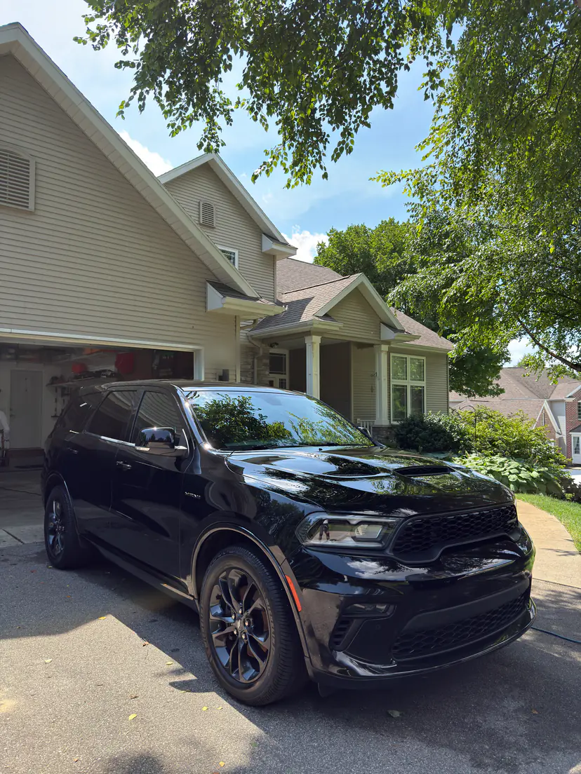 Black Dodge Durango R/T after an exterior detail in a home driveway