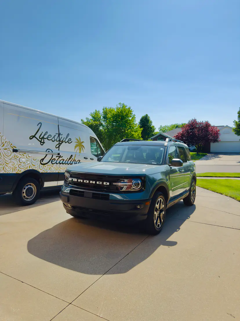 Ford Bronco Sport after an exterior detail, the Lifestyle Detailing van in the driveway