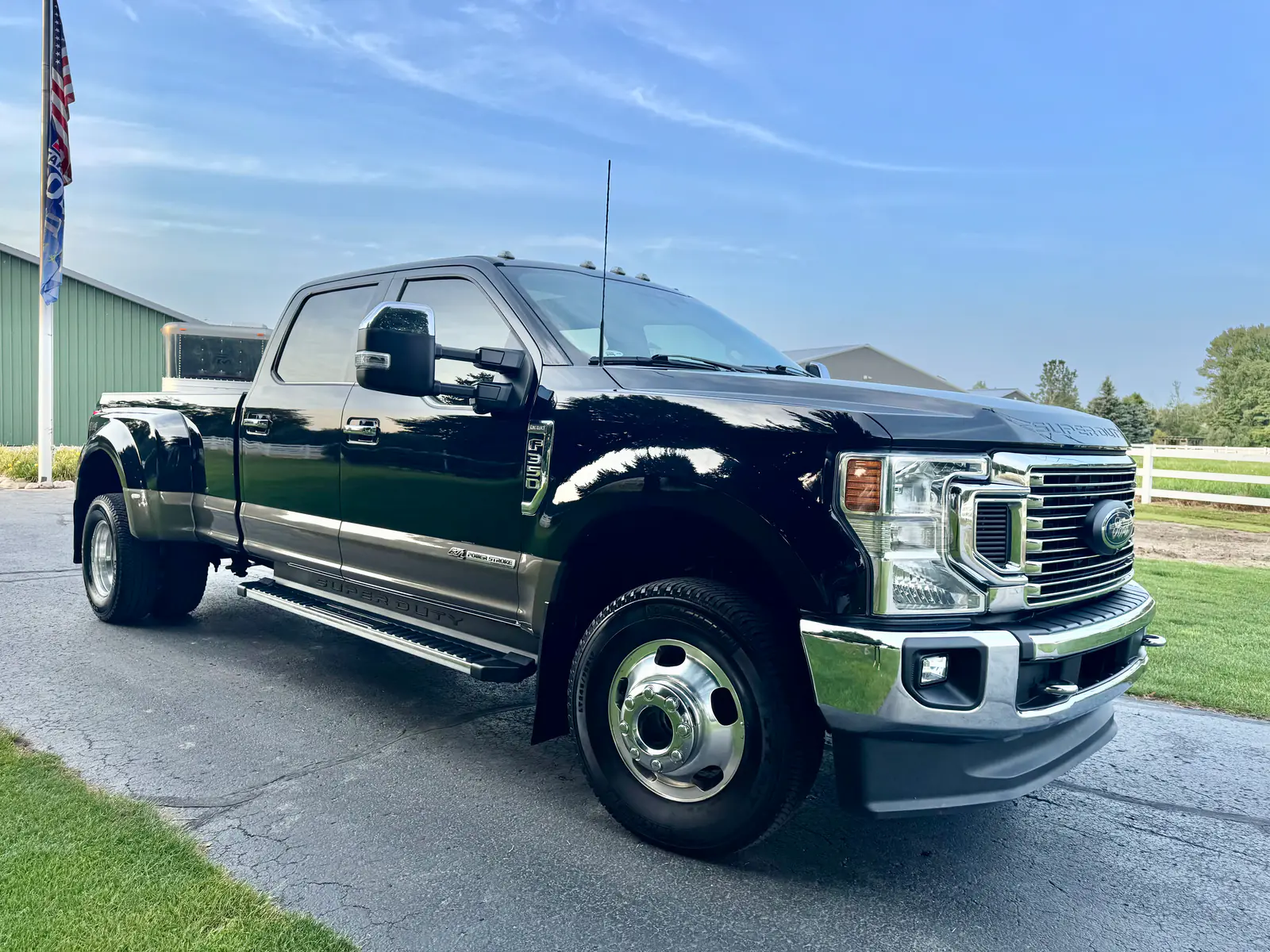 Black Ford F-350 Super Duty dually with a deep gloss after an exterior detail on a country drive