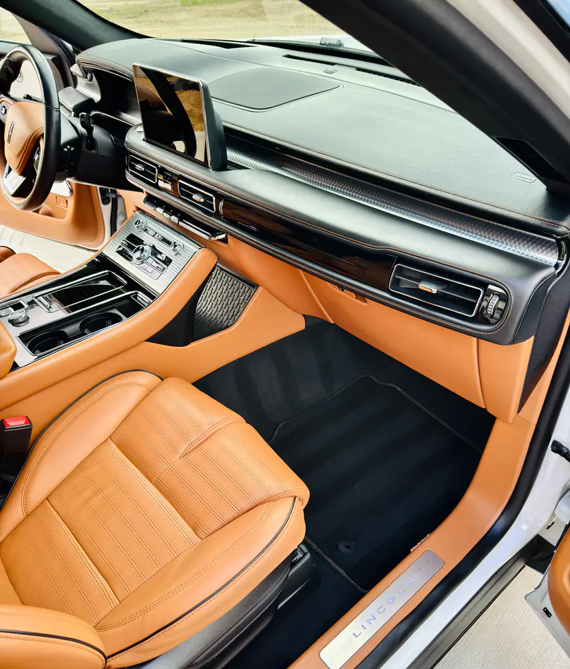 Lincoln Aviator interior in cognac leather after a mobile interior detail, the Lincoln sill plate in view