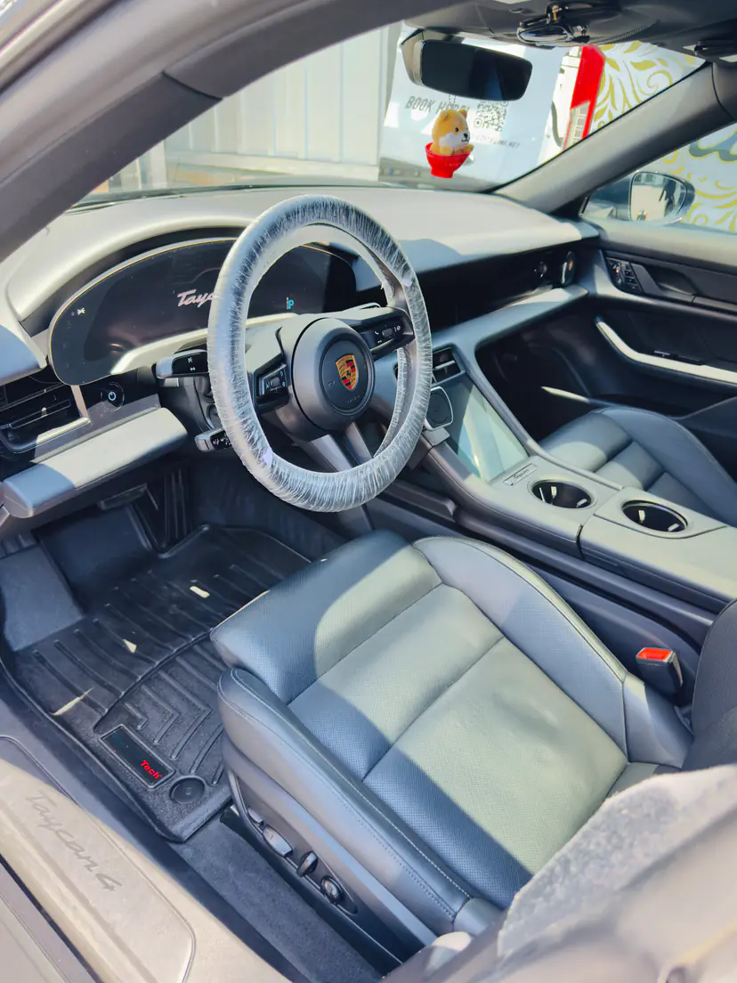 Porsche Taycan cabin in grey leather after a mobile interior detail in Wyoming, Michigan
